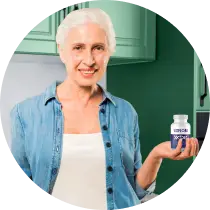VisiFlora customer holding a bottle of the eye health supplement